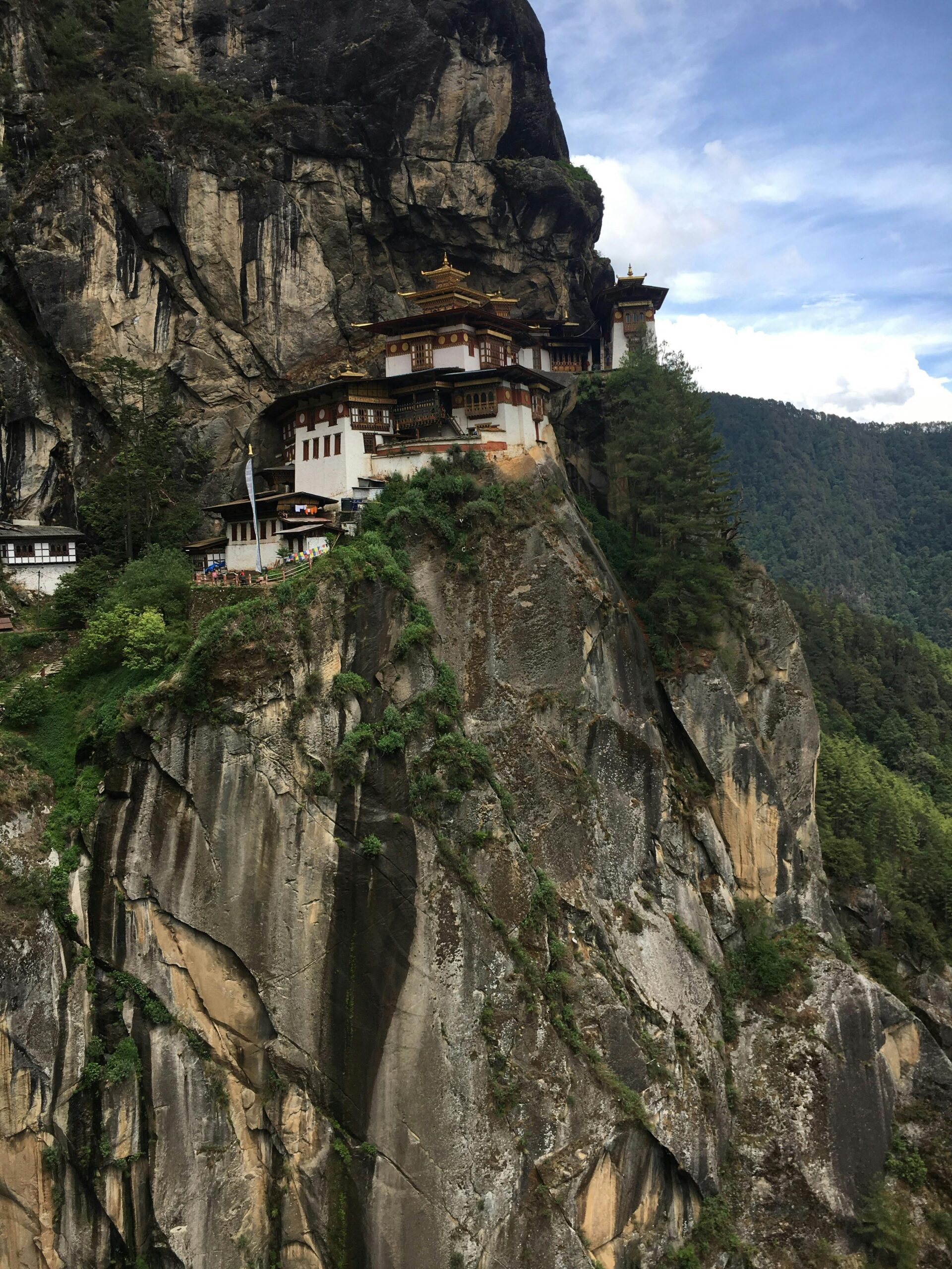Breathtaking view of Paro Taktsang, a Buddhist monastery nestled on a cliff in Bhutan's mountains.